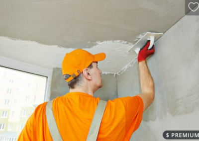 Plasterer skimming a ceiling for a smooth finish